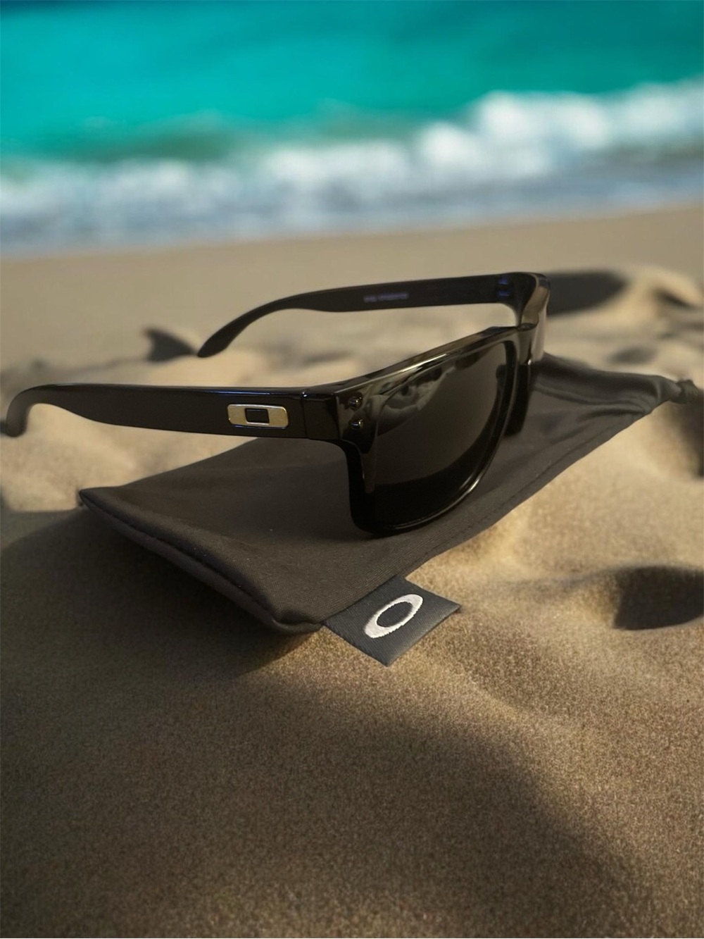 Oakley Holbrook Collection. Black/Gold frames with polarized lenses.